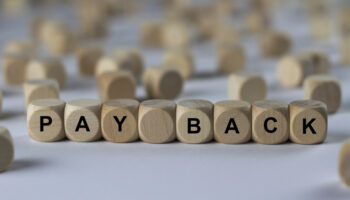 pay-back-cube-with-letters-sign-with-wooden-cubes