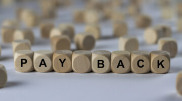 pay-back-cube-with-letters-sign-with-wooden-cubes