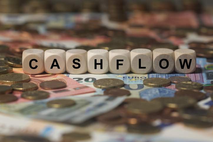 cashflow-cube-with-letters-money-sector-terms-sign-with-wooden-cubes