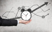 businessmans-hand-holds-an-alarm-clock
