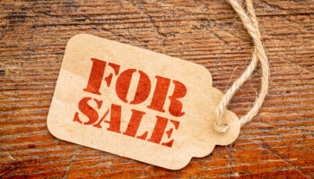 for-sale-sign-on-a-price-tag