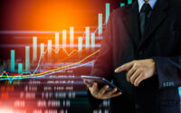 business-man-on-digital-stock-market-financial-indicator-background